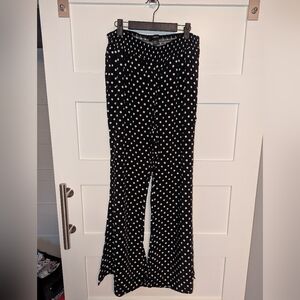 Women's/Juniors black and white polka dot pants in size 1X. Elastic waist.